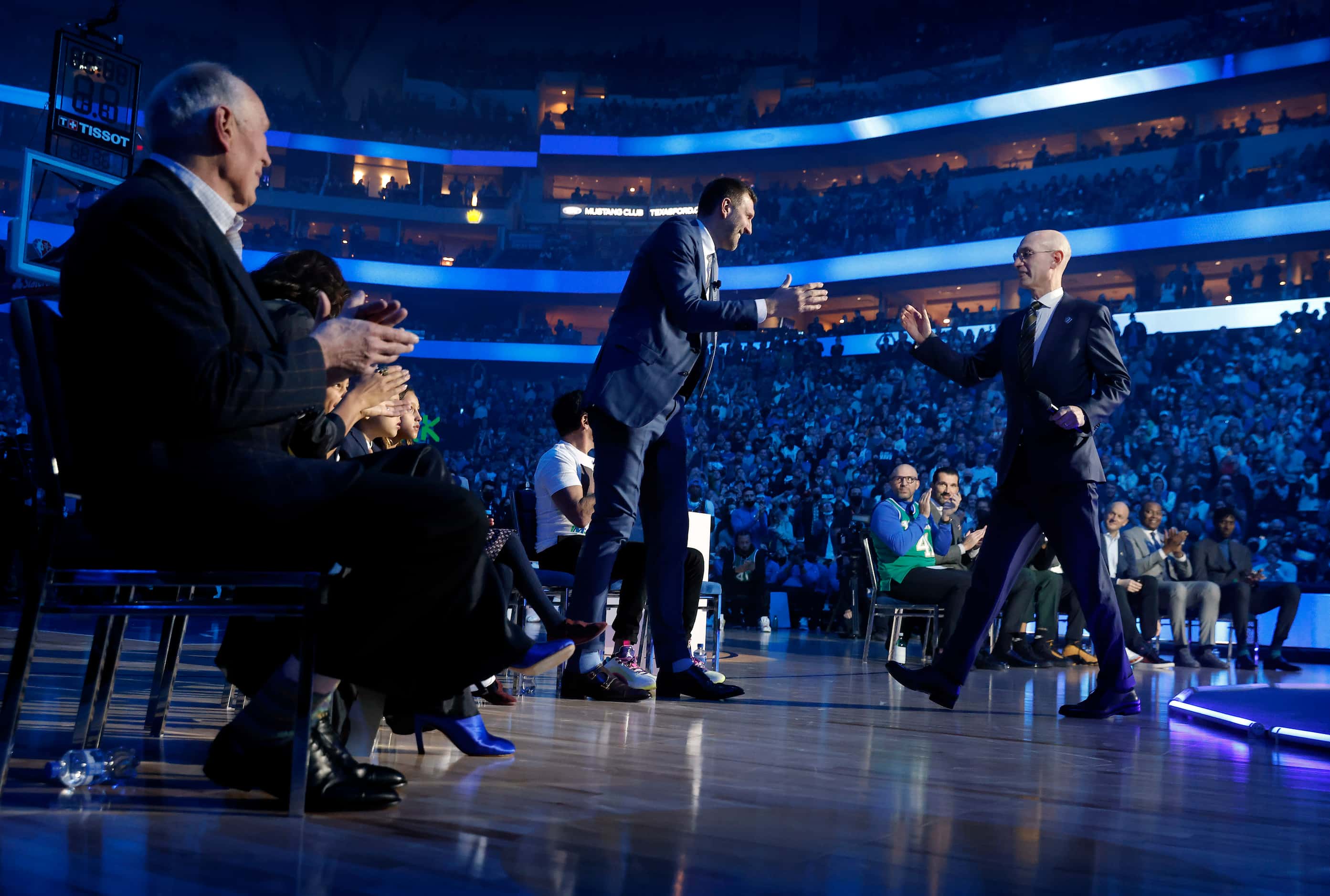 After making some remarks, former Dallas Mavericks All-Star Dirk Nowitzki (left) gives a...