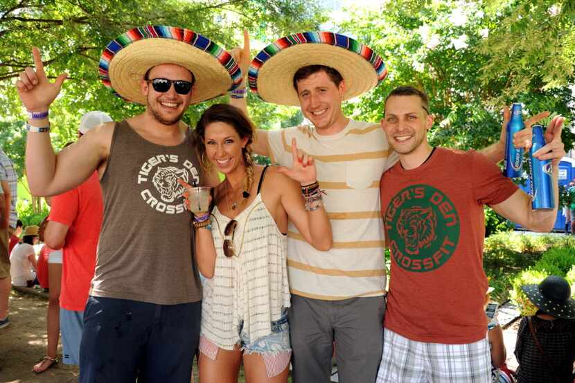 Friends relax in the sun at Taco Libre at Main Street Garden in Dallas, TX on June 27, 2015....