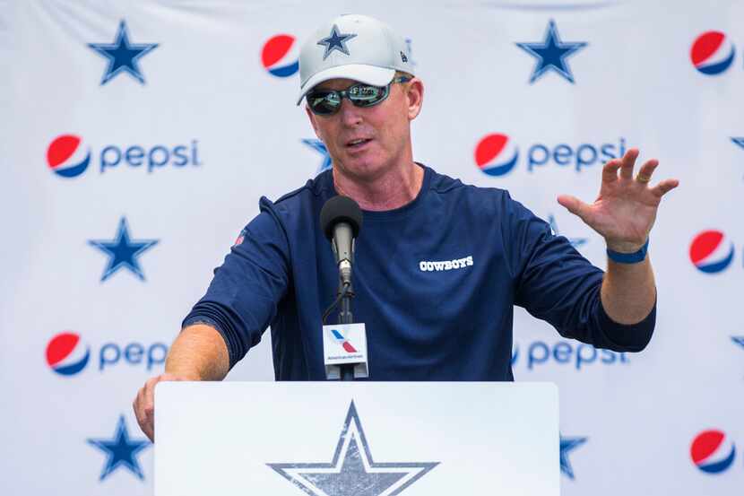 Dallas Cowboys head coach Jason Garrett speaks to reporters before an afternoon practice at...