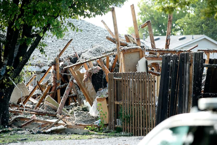 Debris was all that was left on the site of a home explosion Monday.