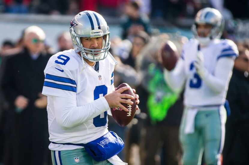 Dallas Cowboys quarterback Tony Romo (9) and quarterback Mark Sanchez (3) warm up before an...