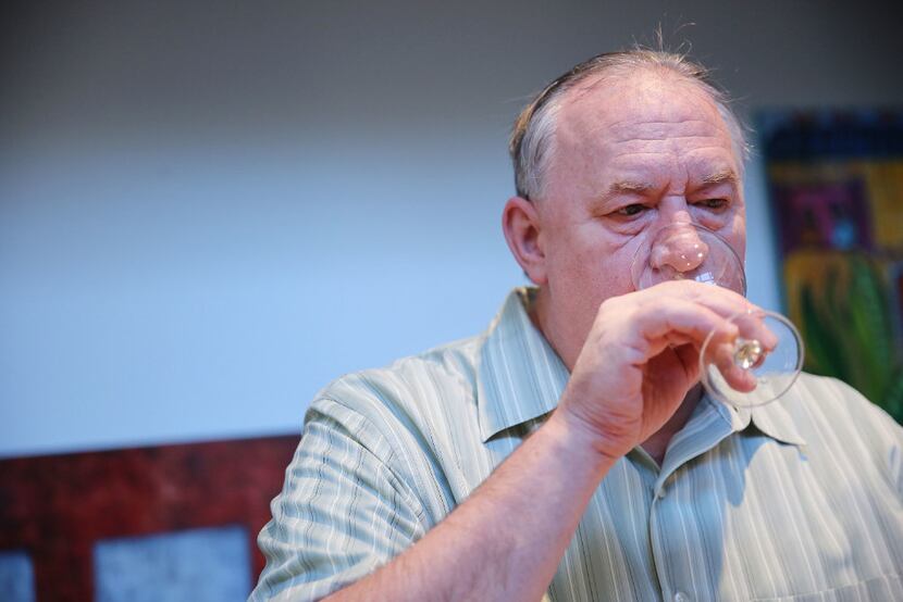 Paul Botamer sips wine as part of The Dallas Morning News wine panel. (Andy Jacobsohn/Staff...