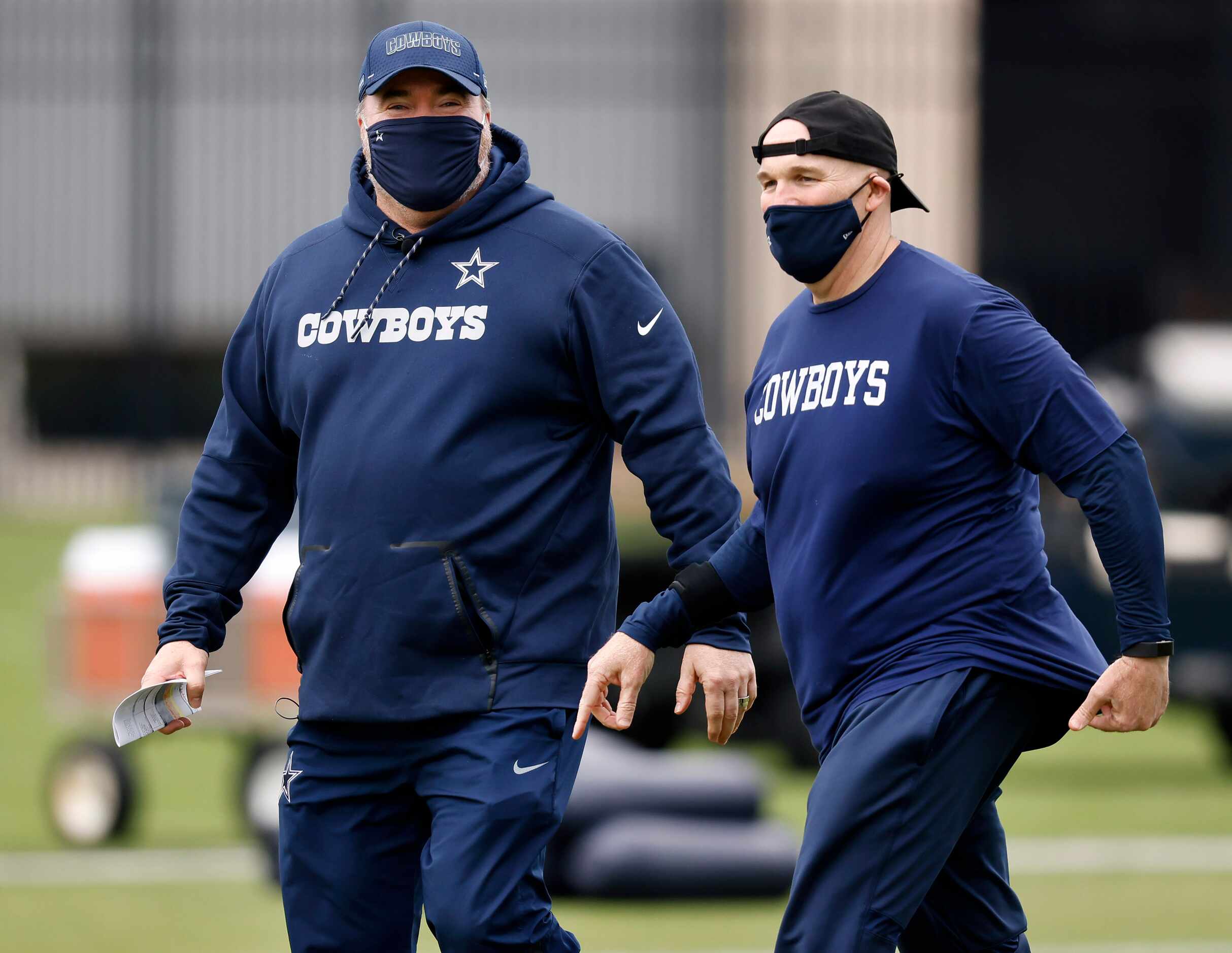 Dallas Cowboys head coach Mike McCarthy (left) and defensive coordinator Dan Quinn watch...
