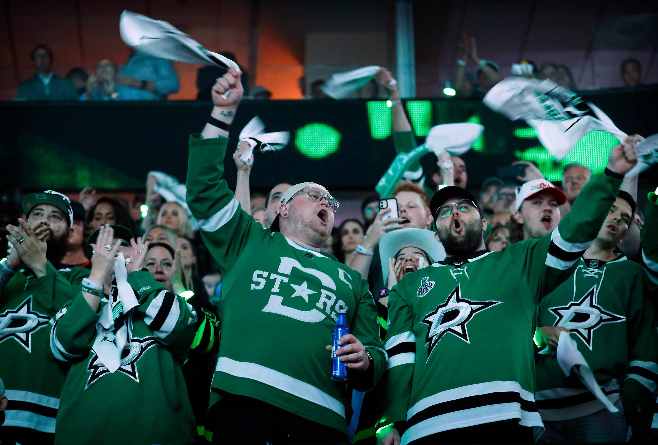 Dallas Stars fans cheer as their team gets ready yo face the Calgary Flames in Game 4 of a...