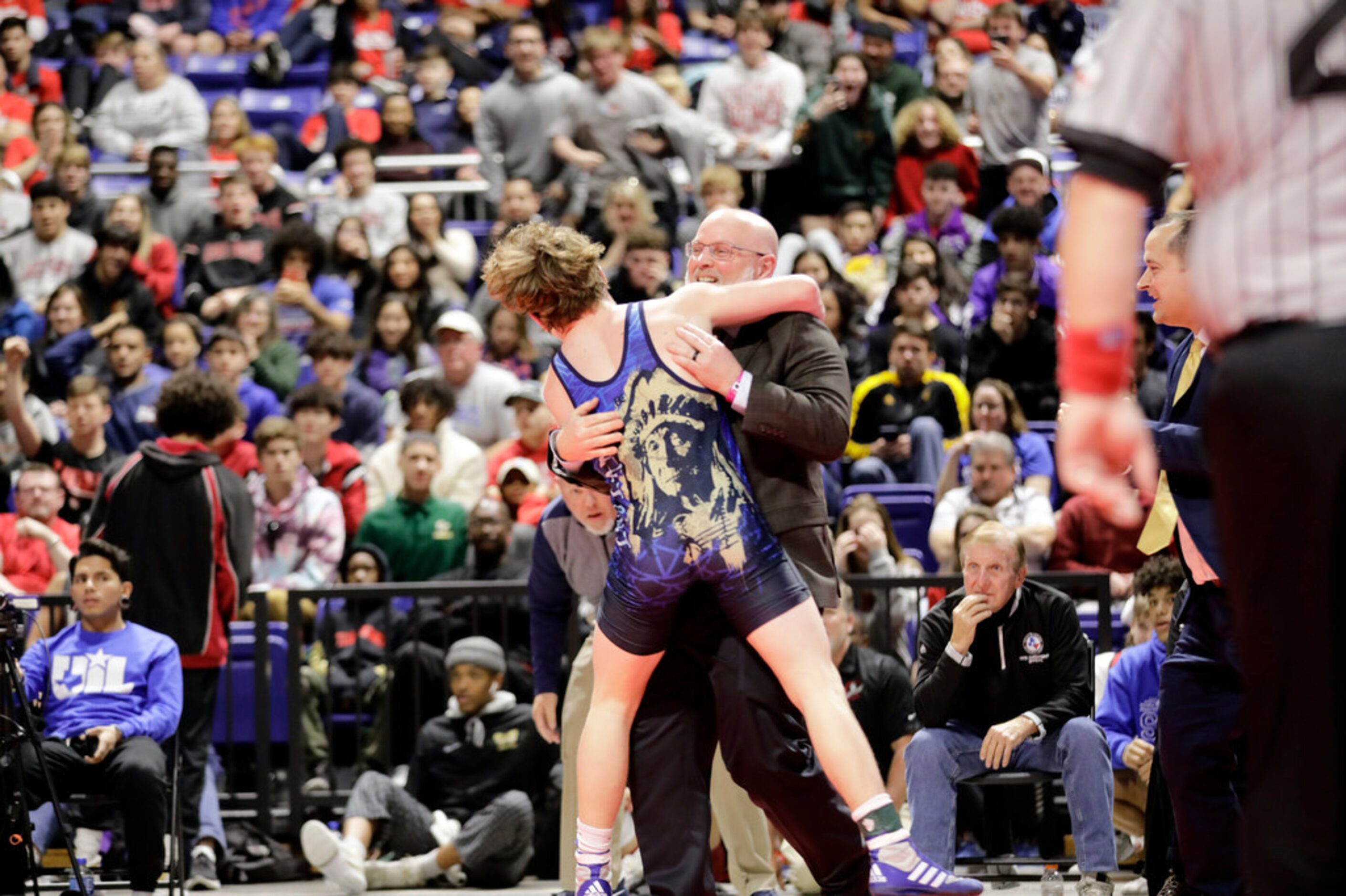 Parker Decker of Keller wrestles against Tagen Jamison of Plano West during the UIL Texas...