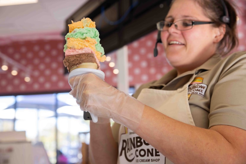 How does shift manager Kairee Torres stack each slice on a Rainbow Cone? Carefully. 