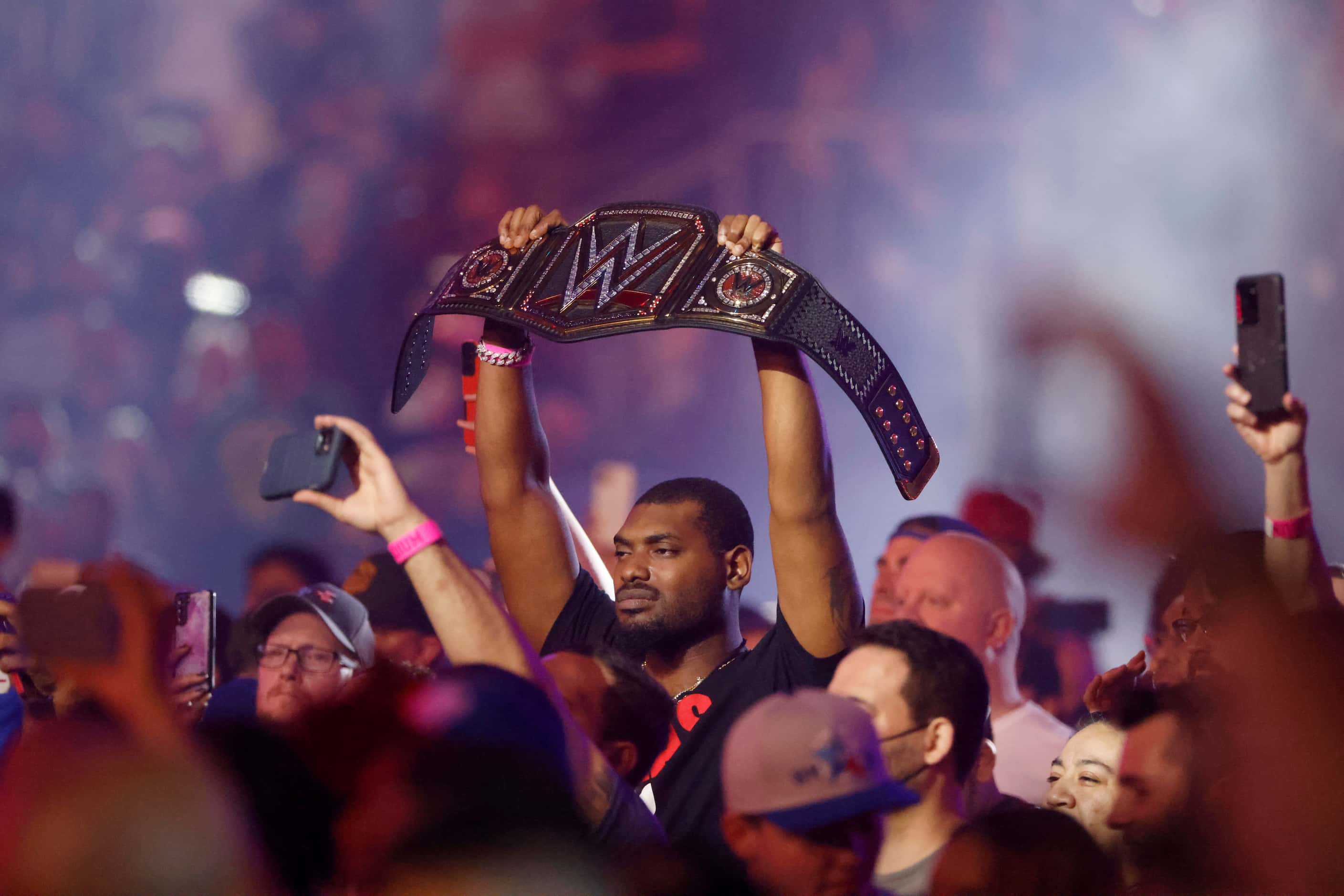 A WWE fan watches a match during WrestleMania in Arlington, Texas on Saturday, April 2, 2022. 