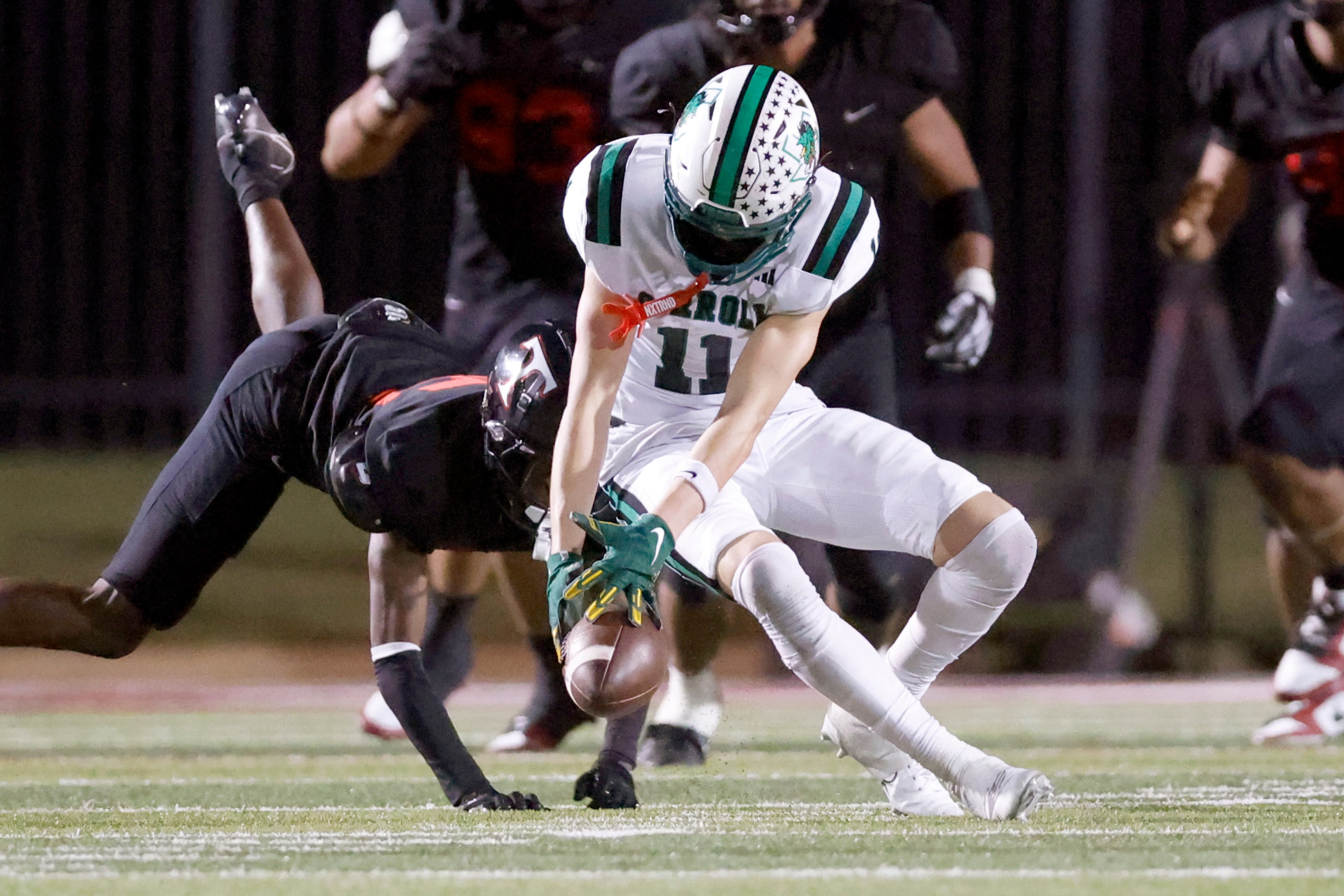 Southlake Carroll wide receiver Brock Boyd (11) makes a finger-tip catch during the second...