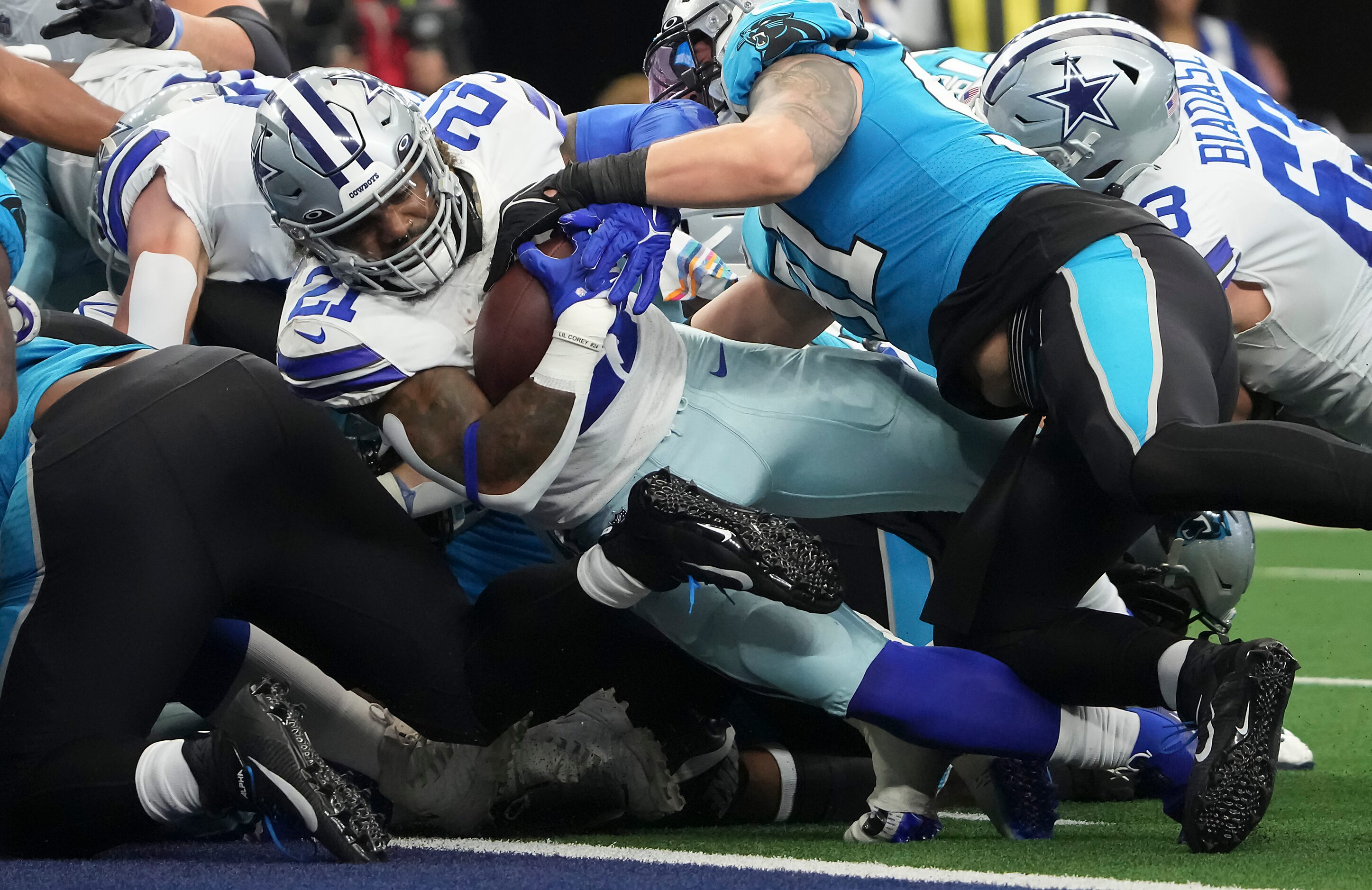 Dallas Cowboys running back Ezekiel Elliott (21) pushes into the end zone for a touchdown...