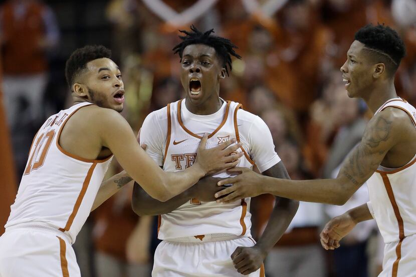 FILE - In this Jan. 23, 2017, file photo, Texas guard Andrew Jones, center, celebrates with...