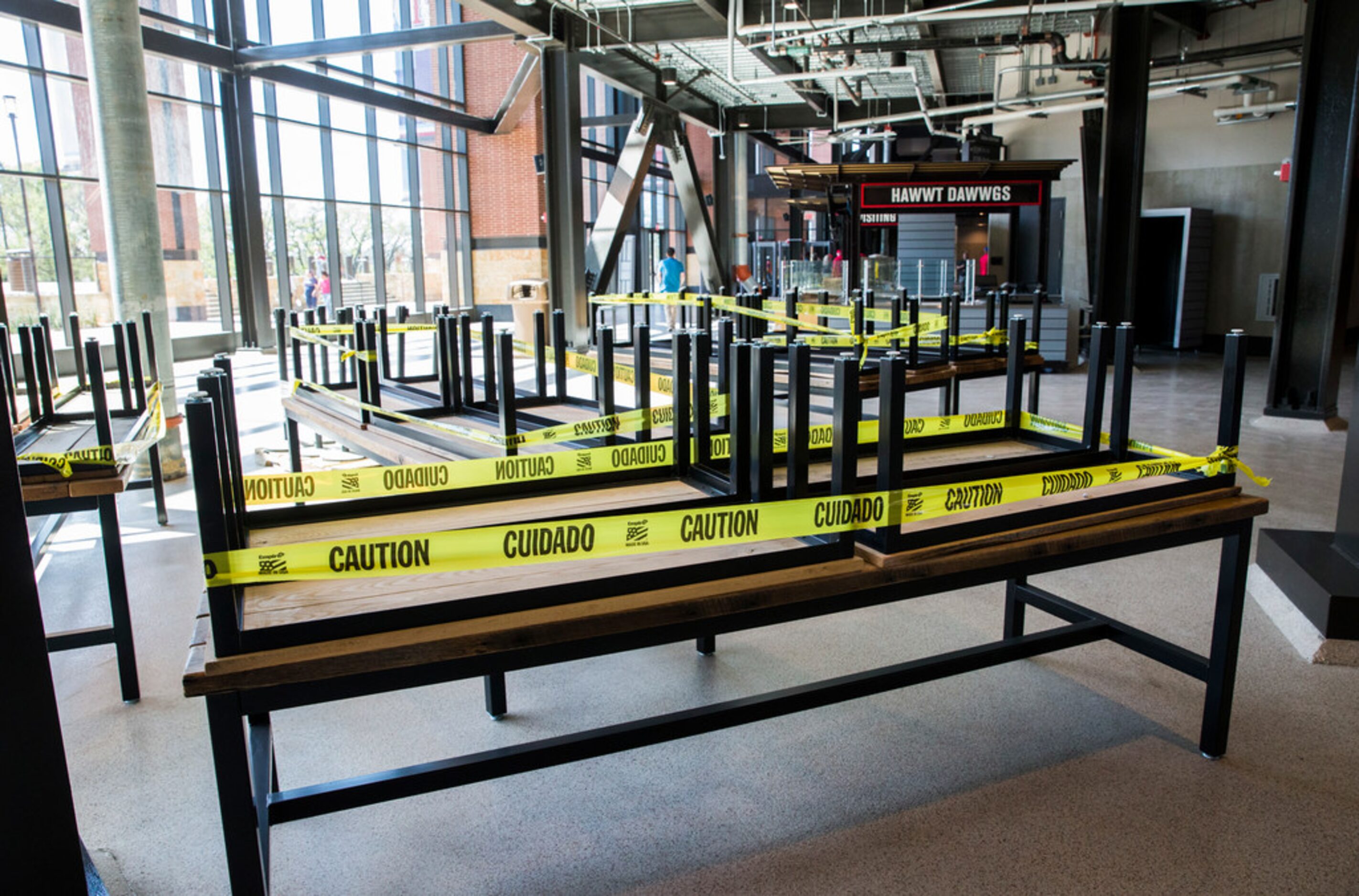 Tables are stacked in the main concourse during an open house at the Texas Rangers' new...