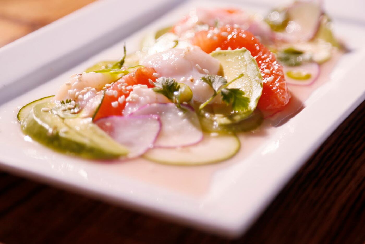 Scallop carpaccio with cucumber, pink grapefruit and radishes