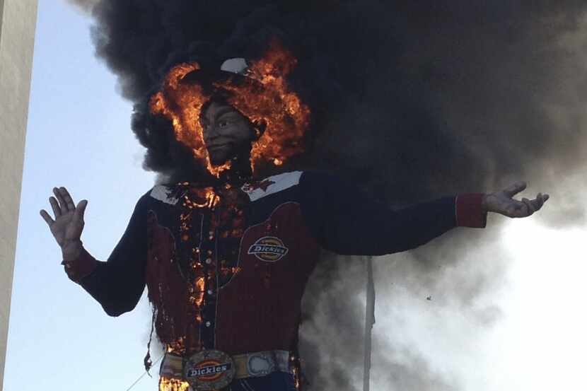 Fire engulfs Big Tex at the State Fair of Texas in Dallas on Friday, Oct. 19, 2012. 