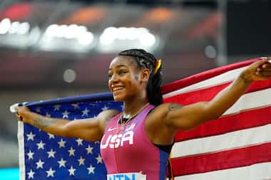 Sha'Carri Richardson, of the United States, celebrates after winning the gold medal in the...