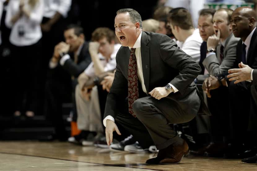 Texas A&M coach Billy Kennedy yells to his players during the second half of an NCAA college...