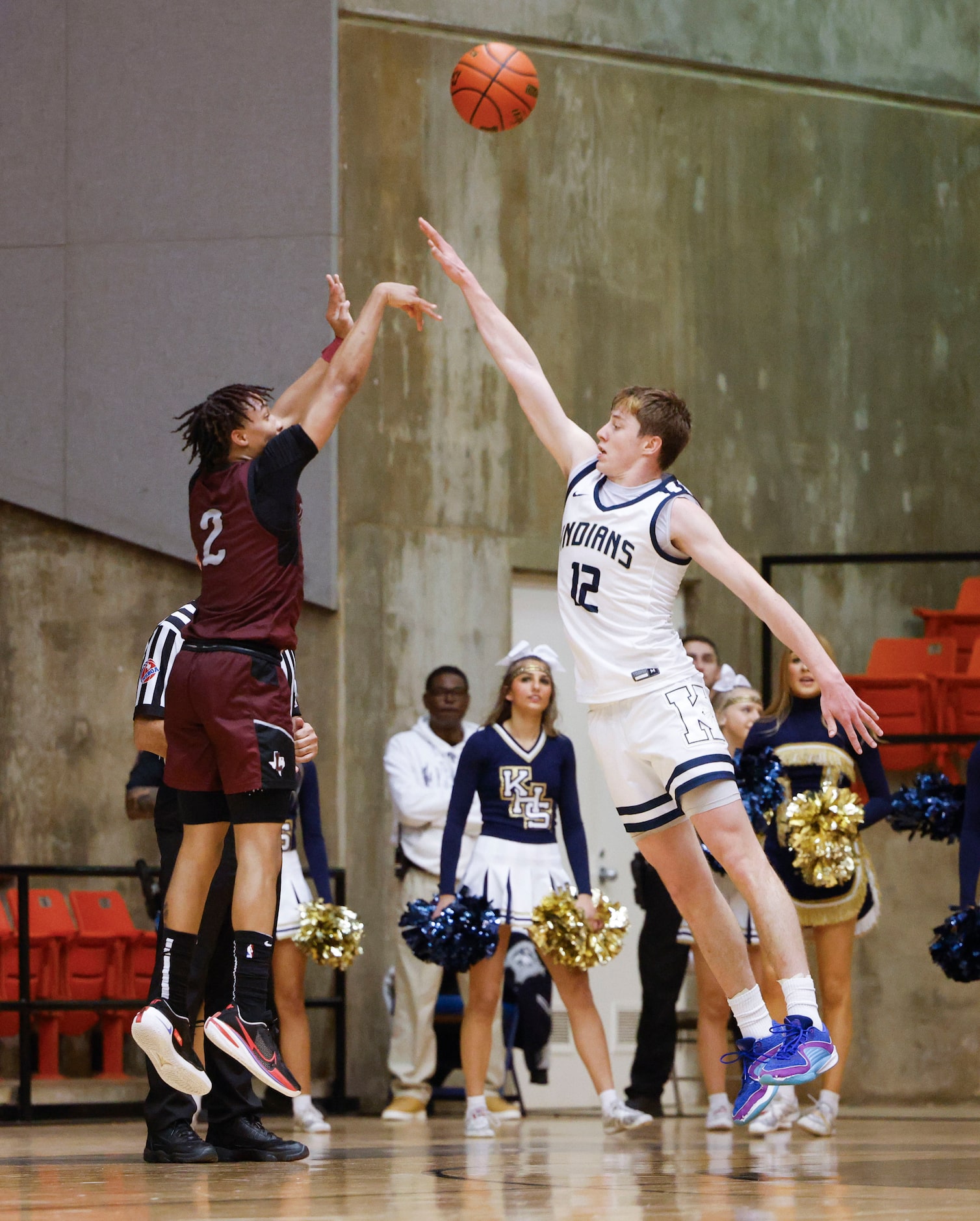 Lewisville High’s Rakai Crawfod (left) shoots a three-pointer as Keller high’s Rhett Schank...