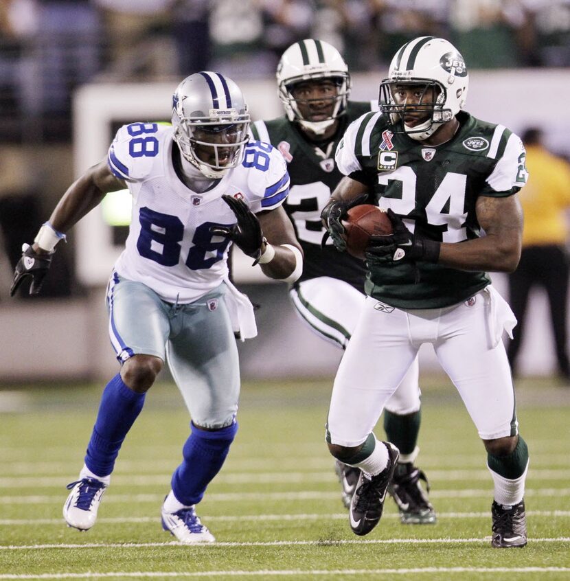 New York Jets defensive back Darrelle Revis (24) runs back an interception intended for...