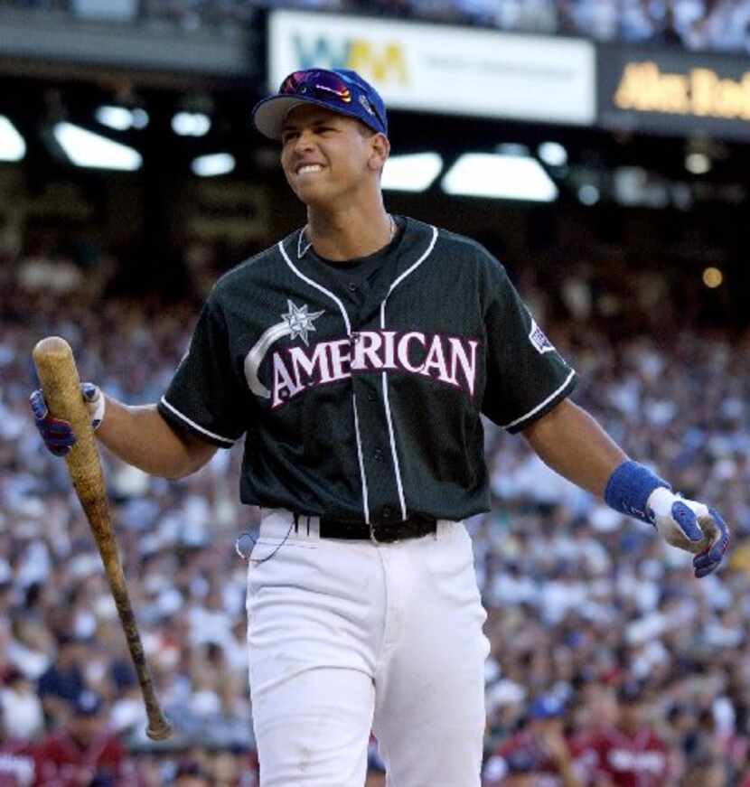 Texas Rangers' Alex Rodriguez reacts after his turn a bat in the first round of the 2001...