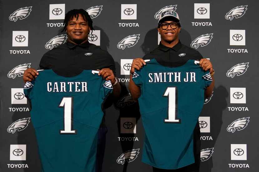 Newly drafted Philadelphia Eagles' Jalen Carter, left, and Nolan Smith pose for a photo...