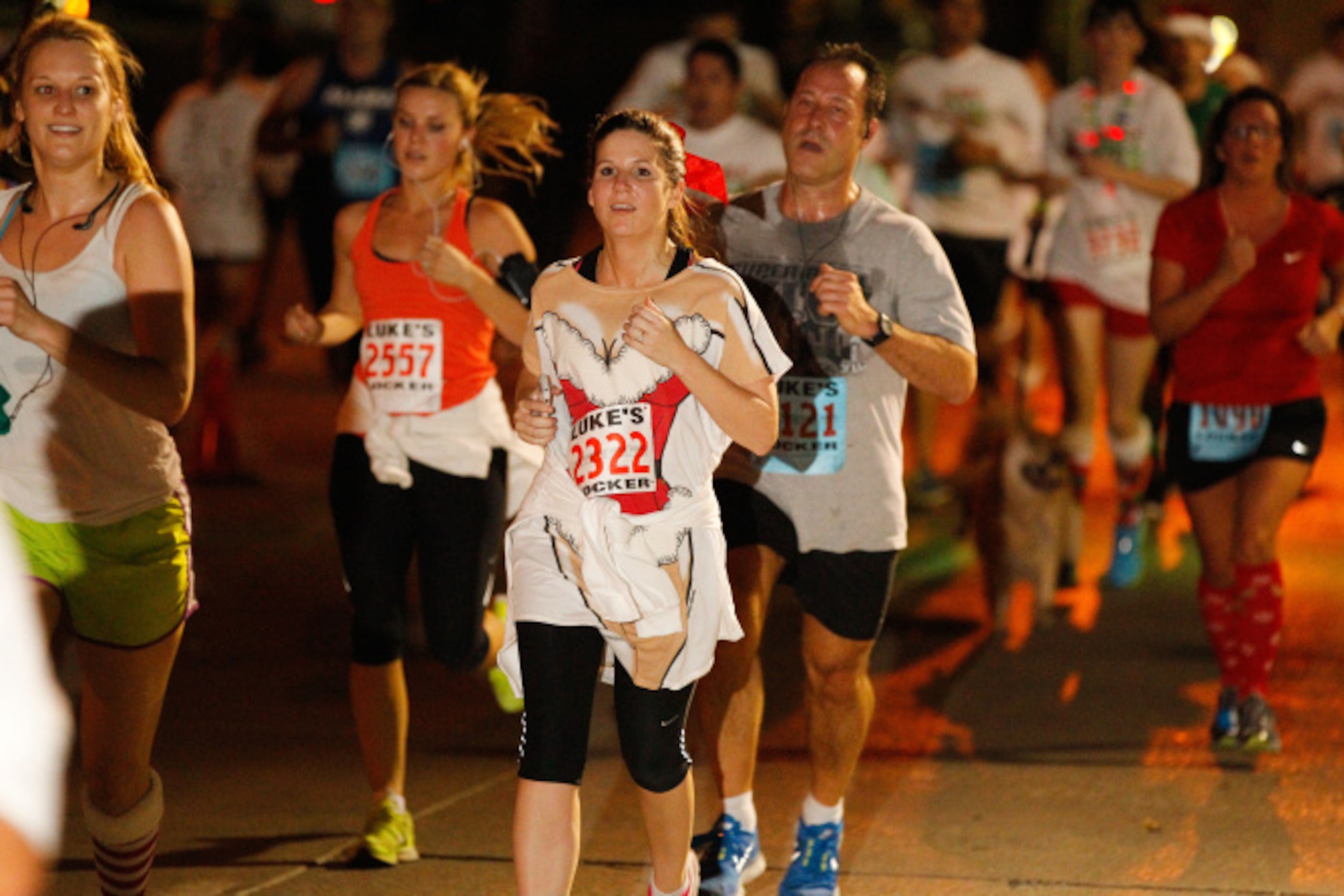 Thousands of runners take the streets for the Jingle Bell Run outside the Hilton Anatole in...