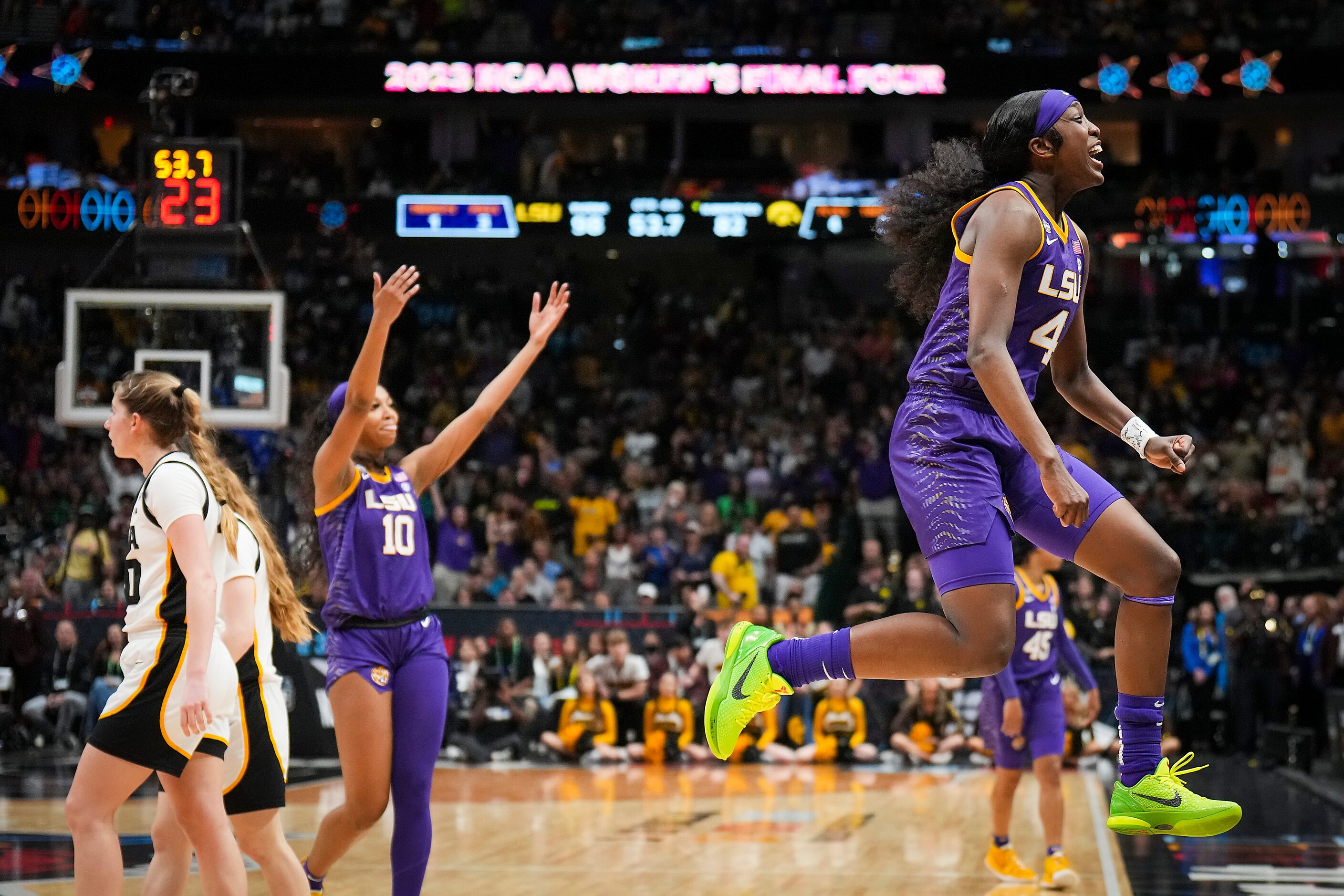 LSU guard Flau'jae Johnson (4) and forward Angel Reese (10) celebrate during the second half...