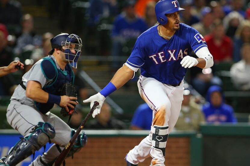 ARLINGTON, TX - APRIL 20: Mike Zunino #3 of the Seattle Mariners looks on as Ronald Guzman...