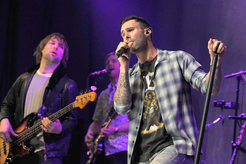 Mickey Madden, left and Adam Levine of Maroon 5 perform in Los Angeles in 2015.