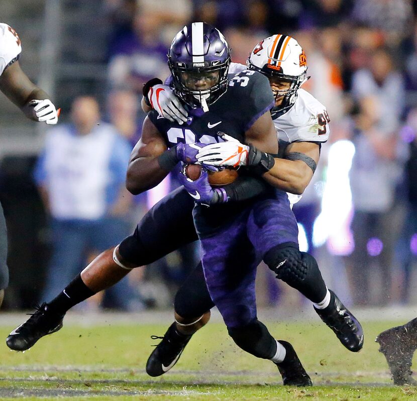 FILE - Oklahoma State Cowboys defensive end Jordan Brailford (94) makes a diving tackle of...