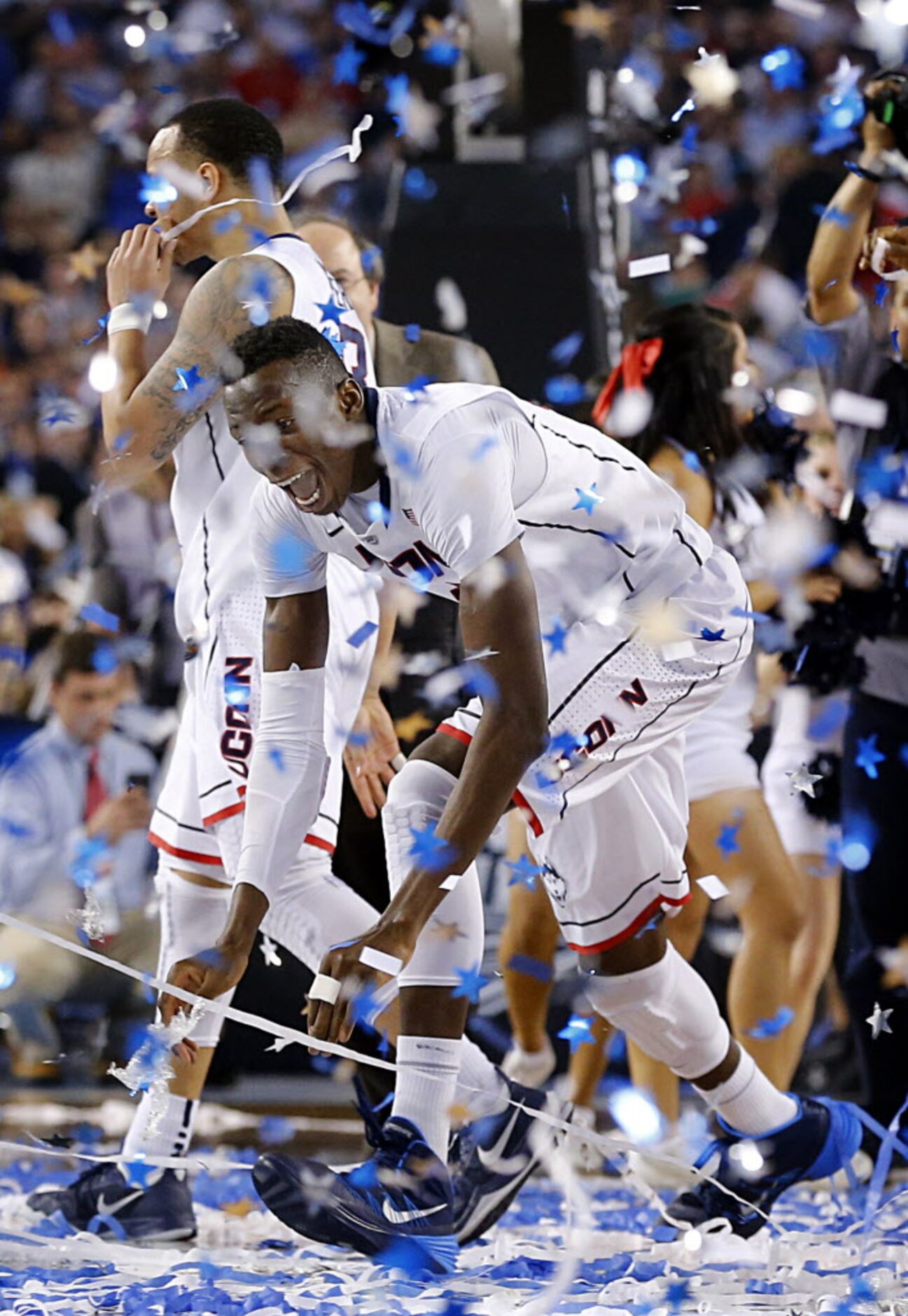 Connecticut Huskies center Amida Brimah (35) dives into the confetti at center court after...