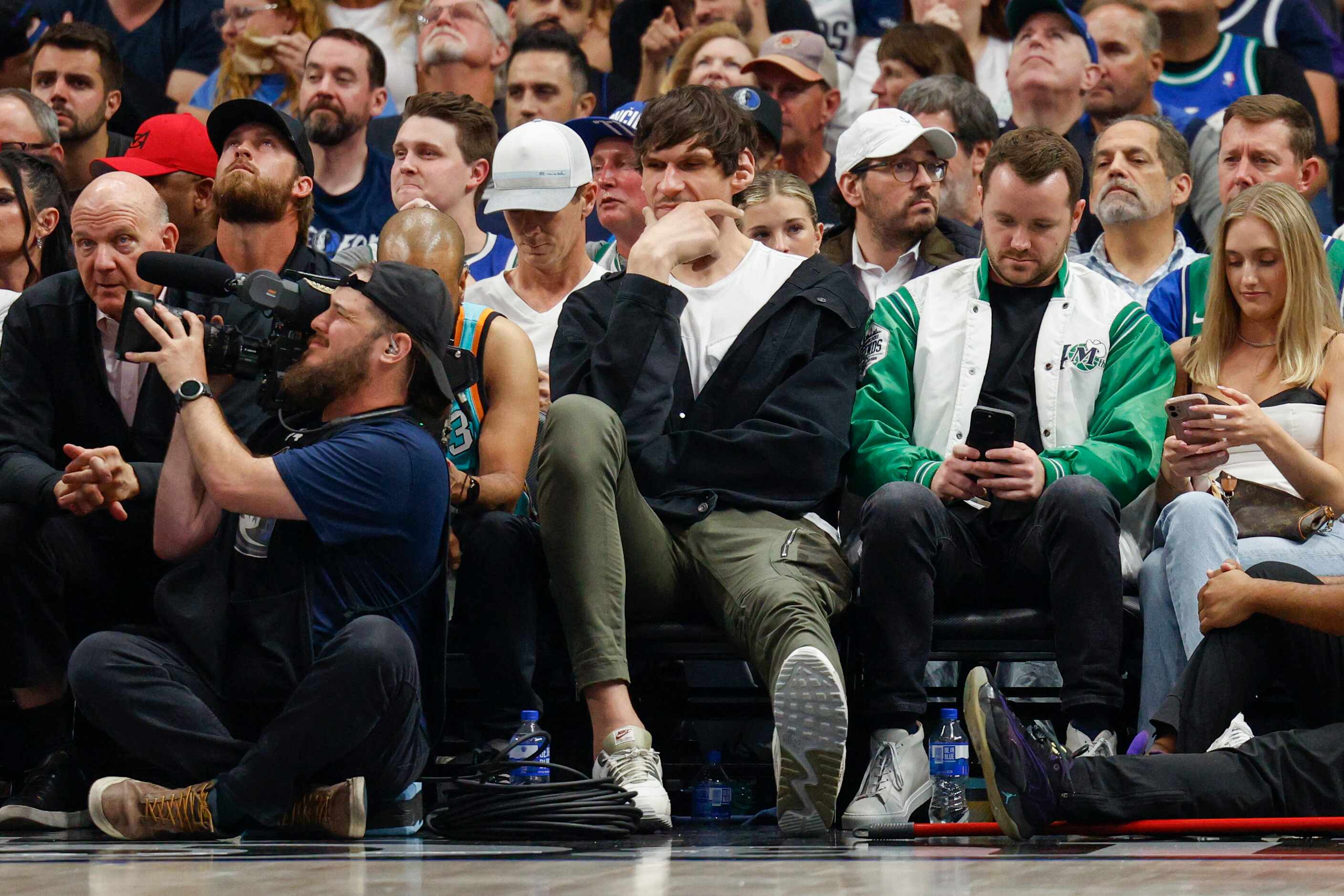 Former Dallas Mavericks player Boban Marjanović watches the first half of Game 6 of an NBA...
