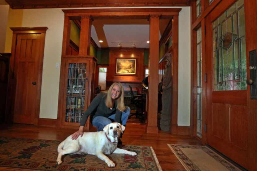 Warm woods and area rugs grace the foyer in the Munger Place home of Valeri Williams, shown...
