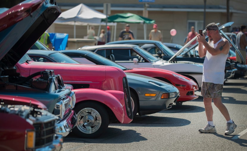 Ricky Moore snaps a photo of a vintage Chevy pickup at a previous Main Street celebration in...