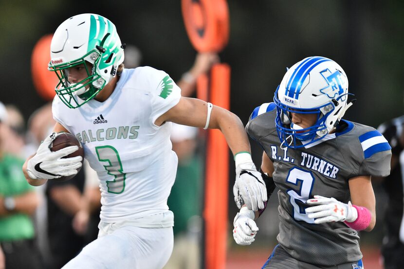 FILE - Lake Dallas sophomore wide receiver Brandon Engel (3) catches a pass, while being...