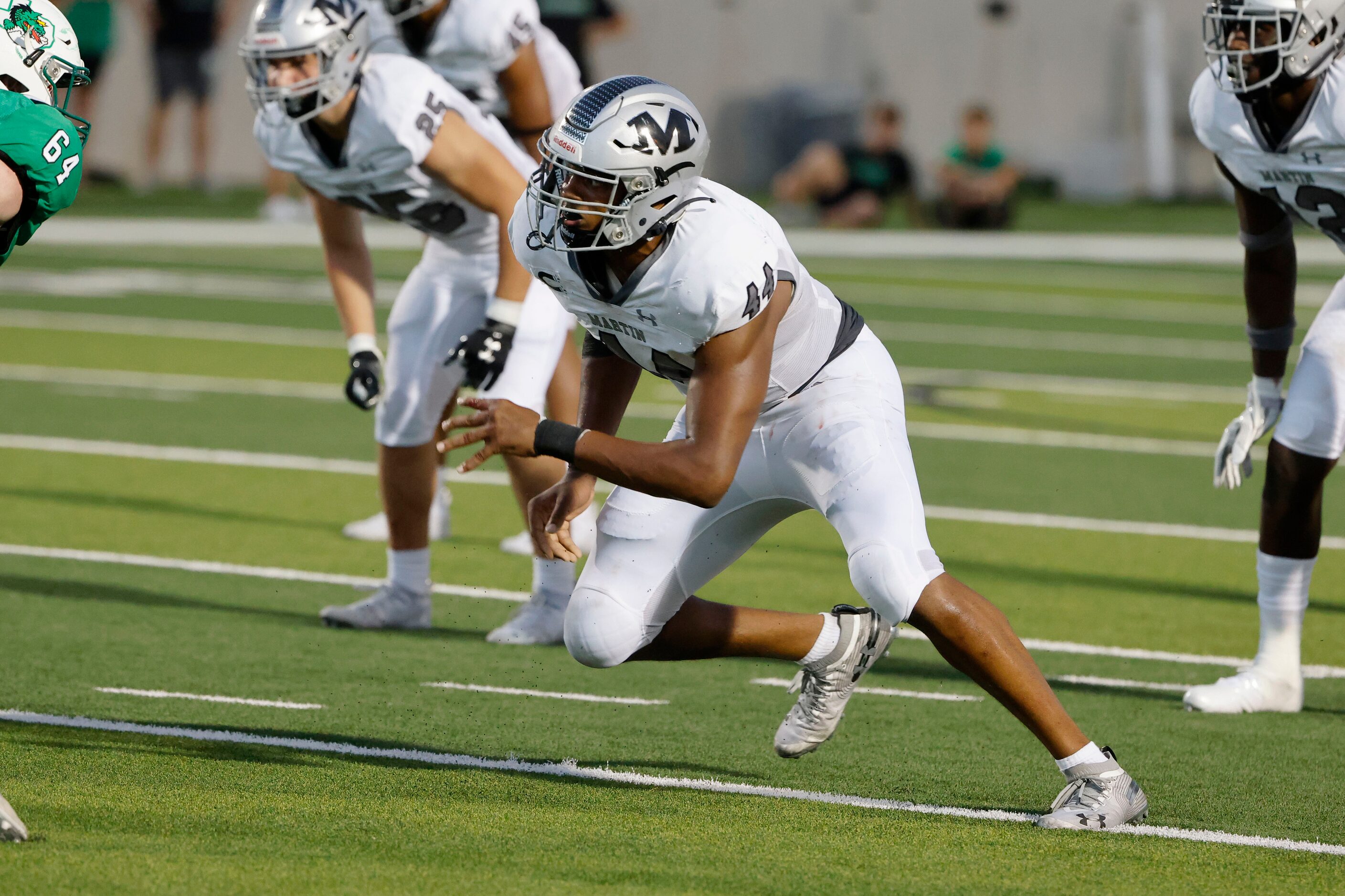 Arlington Martin defensive lineman Ernest Cooper IV, rushes against Southlake Carroll during...