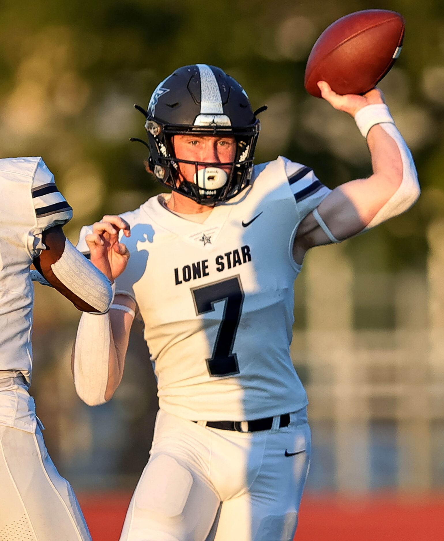 Frisco Lone Star quarterback Bennett Fryman looks to make a pass against Frisco Reedy during...