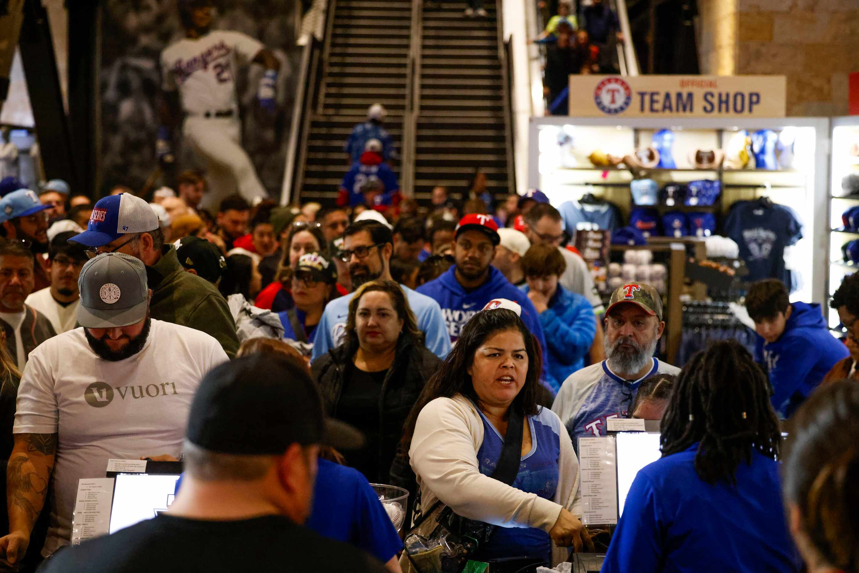 Texas Rangers fans wait in line to buy World Series merchandise following Texas Rangers’...