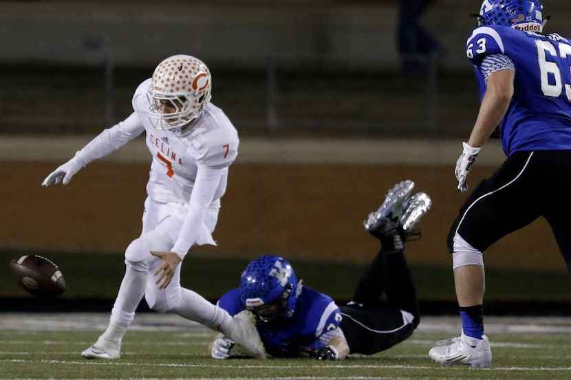 Celina's Caleb Knowles fumbles the ball in the 4th quarter as Celina faces Krum in the Class...