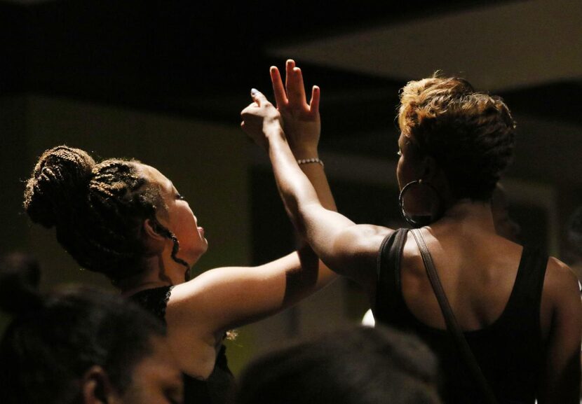 Mourners embraced  during the service. The Rev. Ronnie Goines said he expects police to “be...