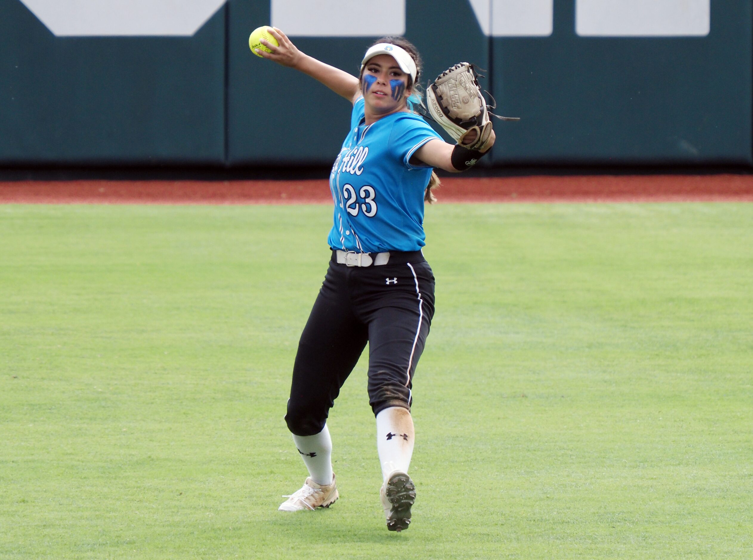 Prosper Rock Hill right fielder Emily Alvarez throws the ball against Montgomery Lake Creek...