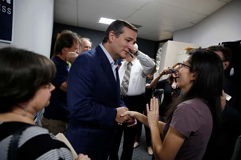 Sen. Ted Cruz greets volunteer shakes hands with Laura Walsh of Keller at the Tarrant County...