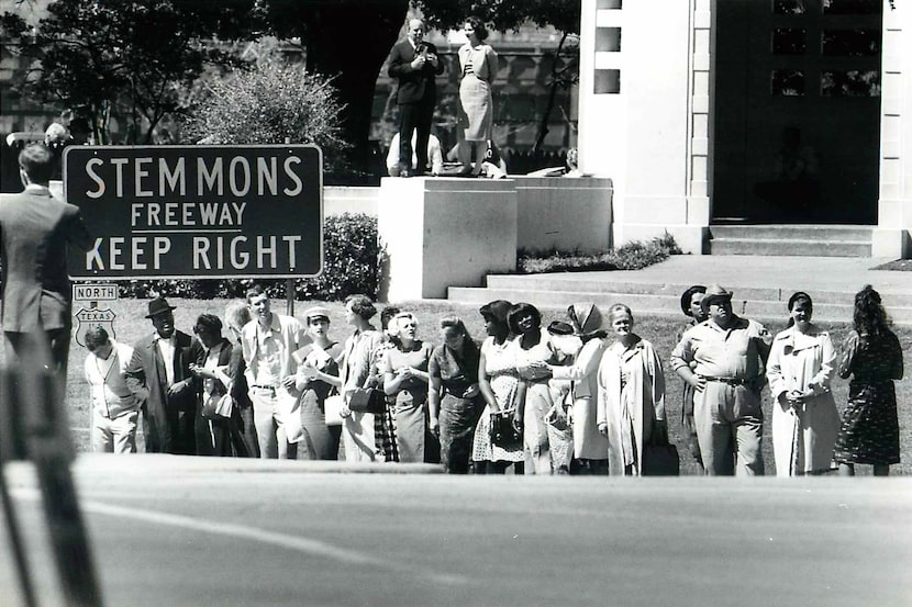 Extras wait for the motorcade to arrive during the filming of Oliver Stone's "JFK."
