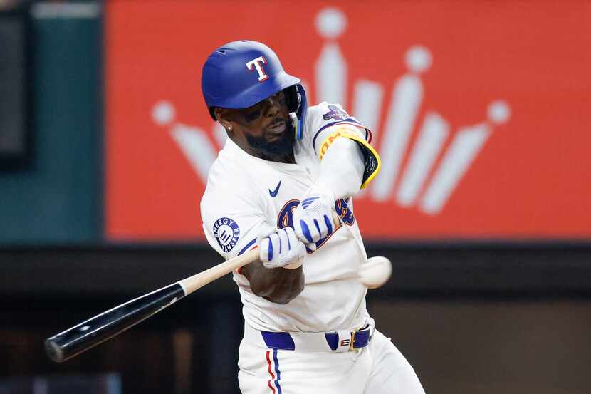 Texas Rangers right fielder Adolis Garcia (53) hits a two-run home run during the third...