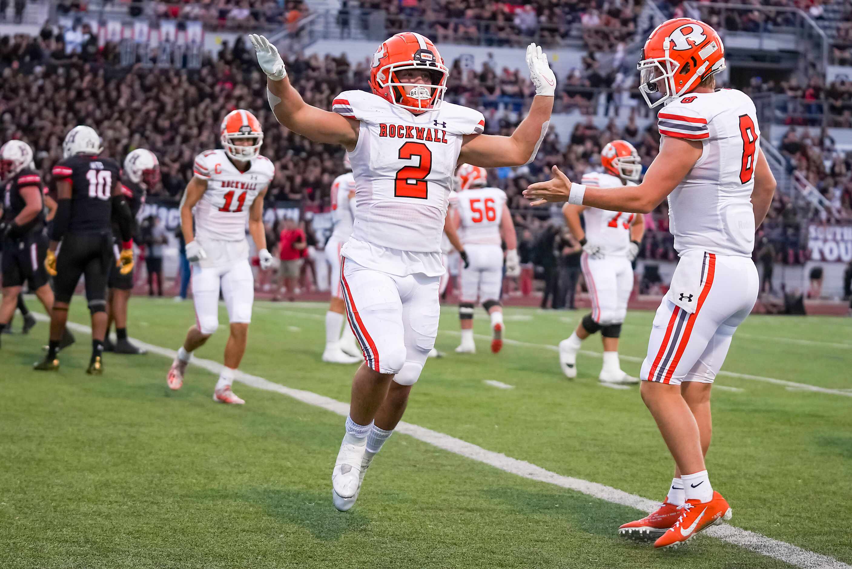 Rockwall running back  Zach Hernandez (2) celebrates with quarterback  Braedyn Locke (8)...