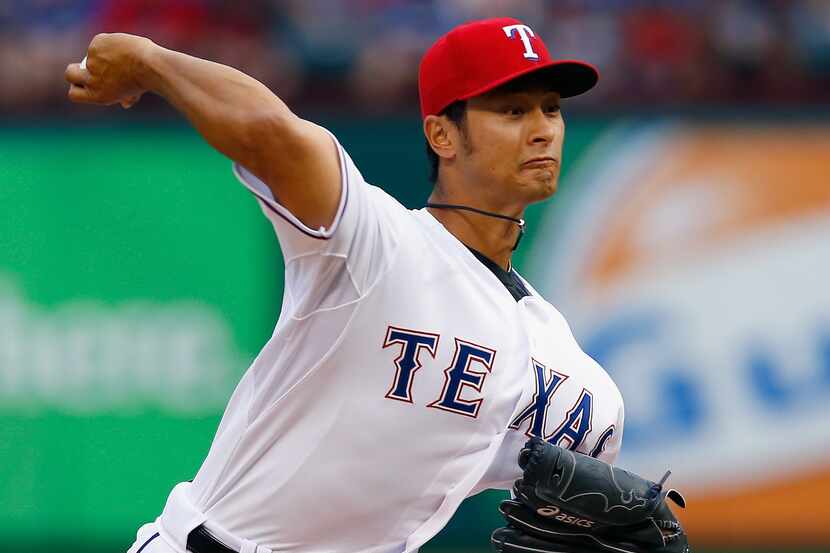 Yu Darvish delivers against the Astros in the top of the first inning at Globe Life Park. 