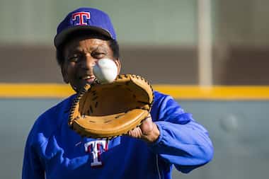 Country music singer Charley Pride plays catch at the Texas Rangers' spring training...