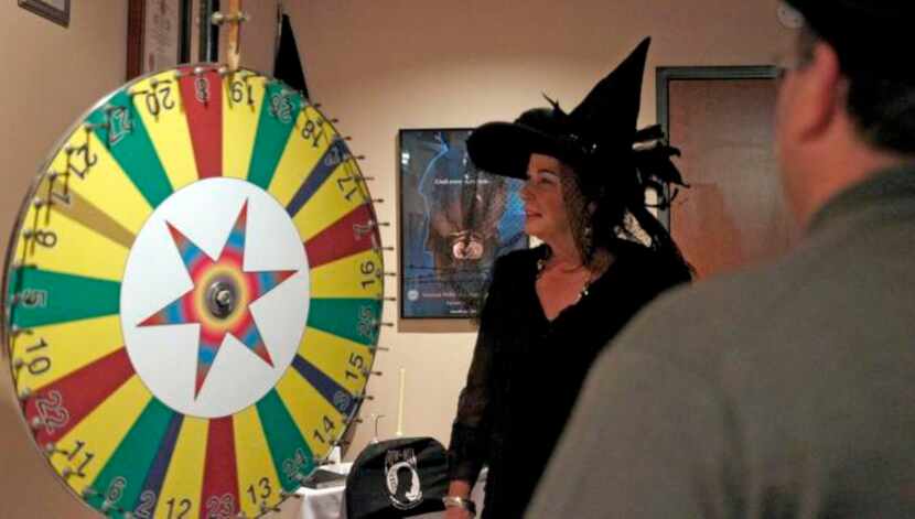 
Denise Paul (left) spins the wheel while Chris Gallucci bets on a color during the VFW Post...
