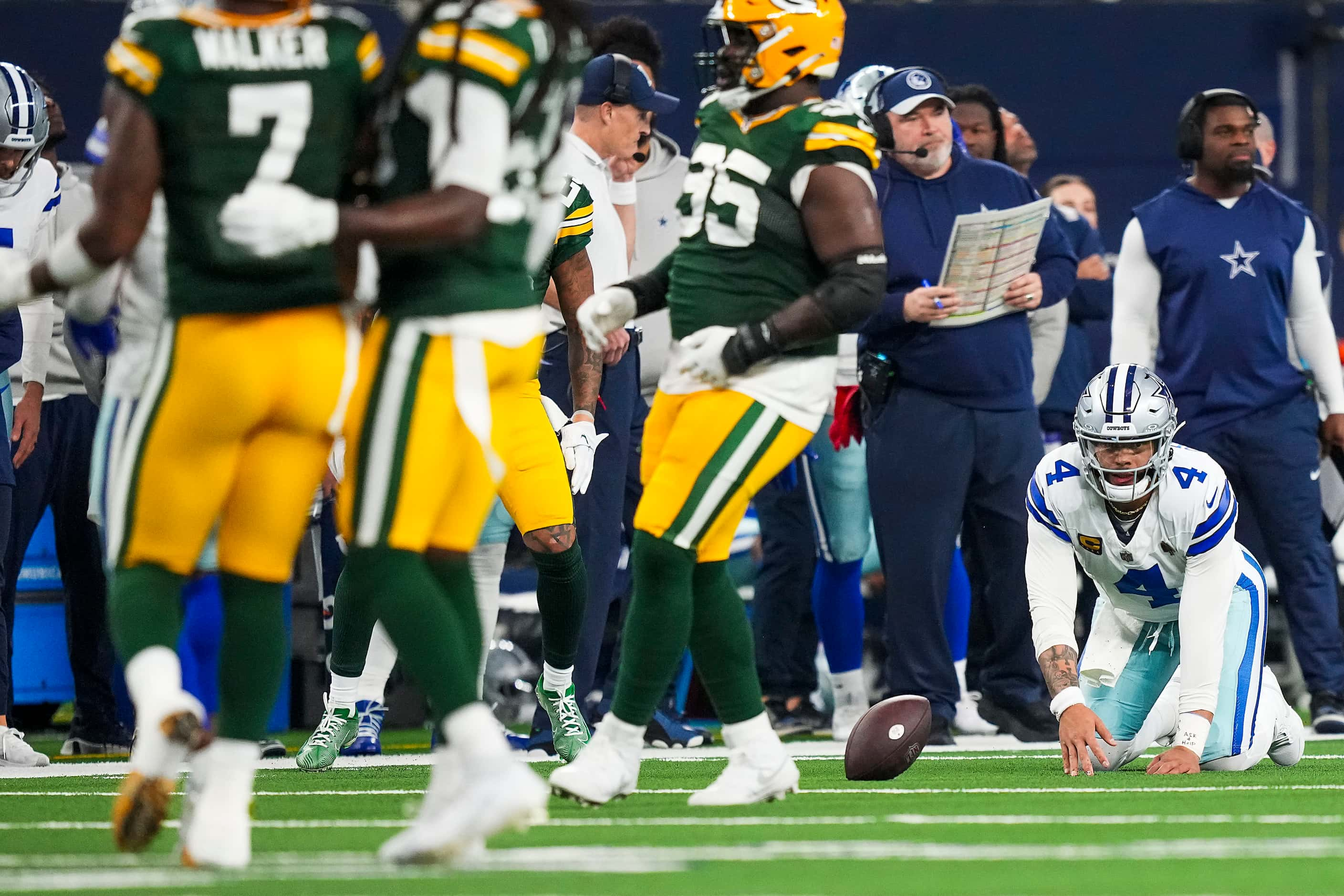 Dallas Cowboys quarterback Dak Prescott (4) is slow to get up after being dropped for a loss...