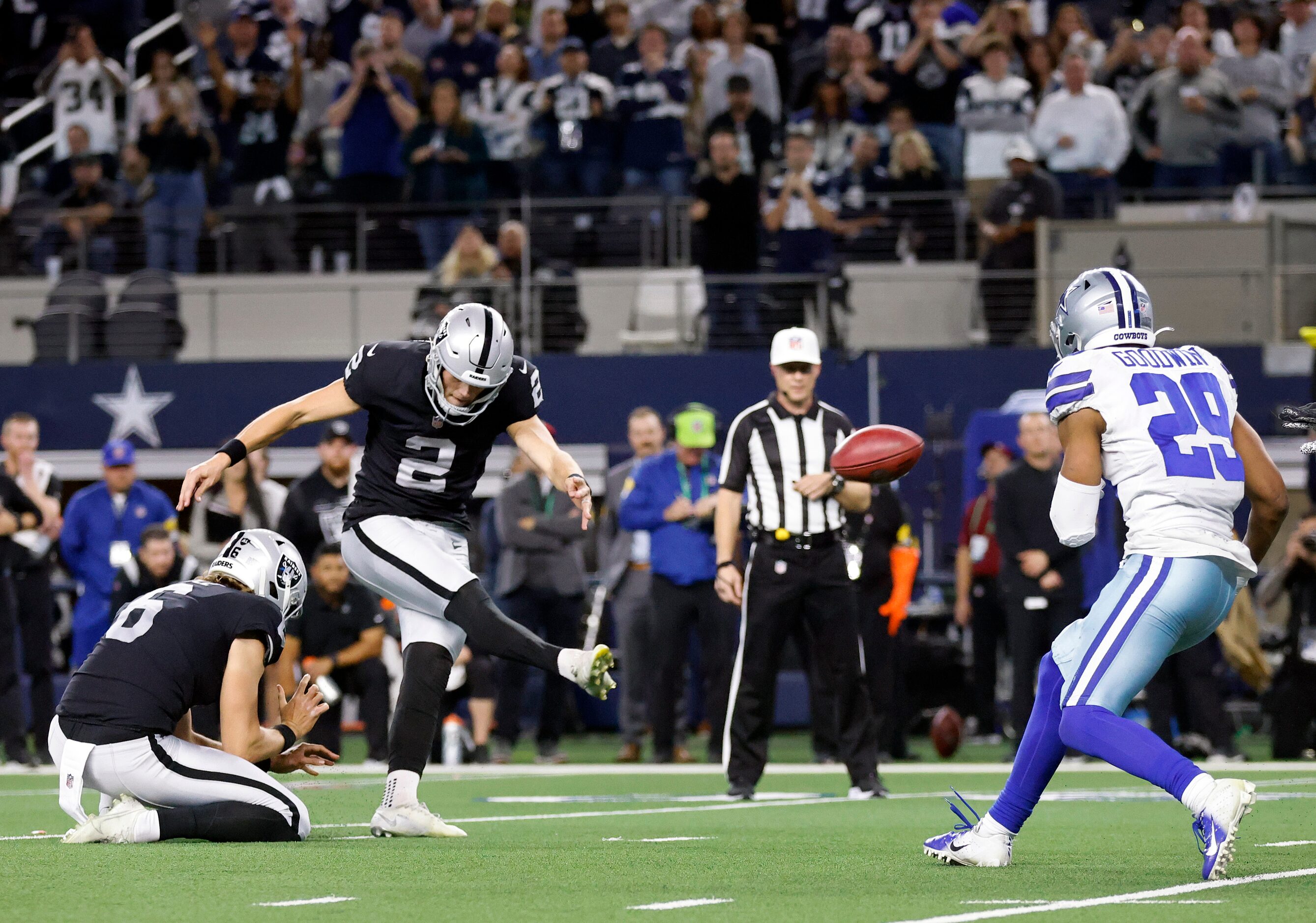 Las Vegas Raiders kicker Daniel Carlson (2) kicks the winning field goal in overtime to...