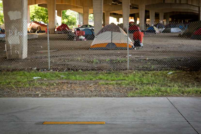 The Santa Fe Trail bike path is located near a homeless encampment underneath I-30 at...