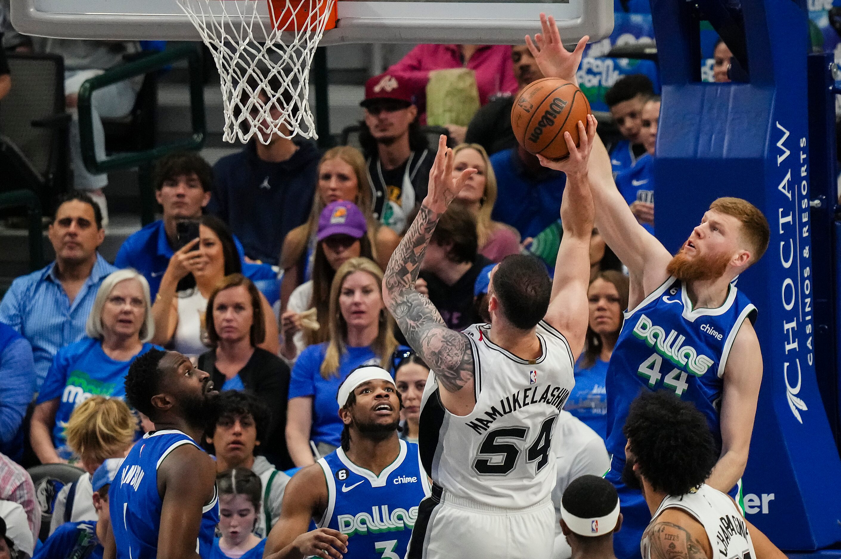 Dallas Mavericks forward Davis Bertans (44) defends a shot by San Antonio Spurs forward...